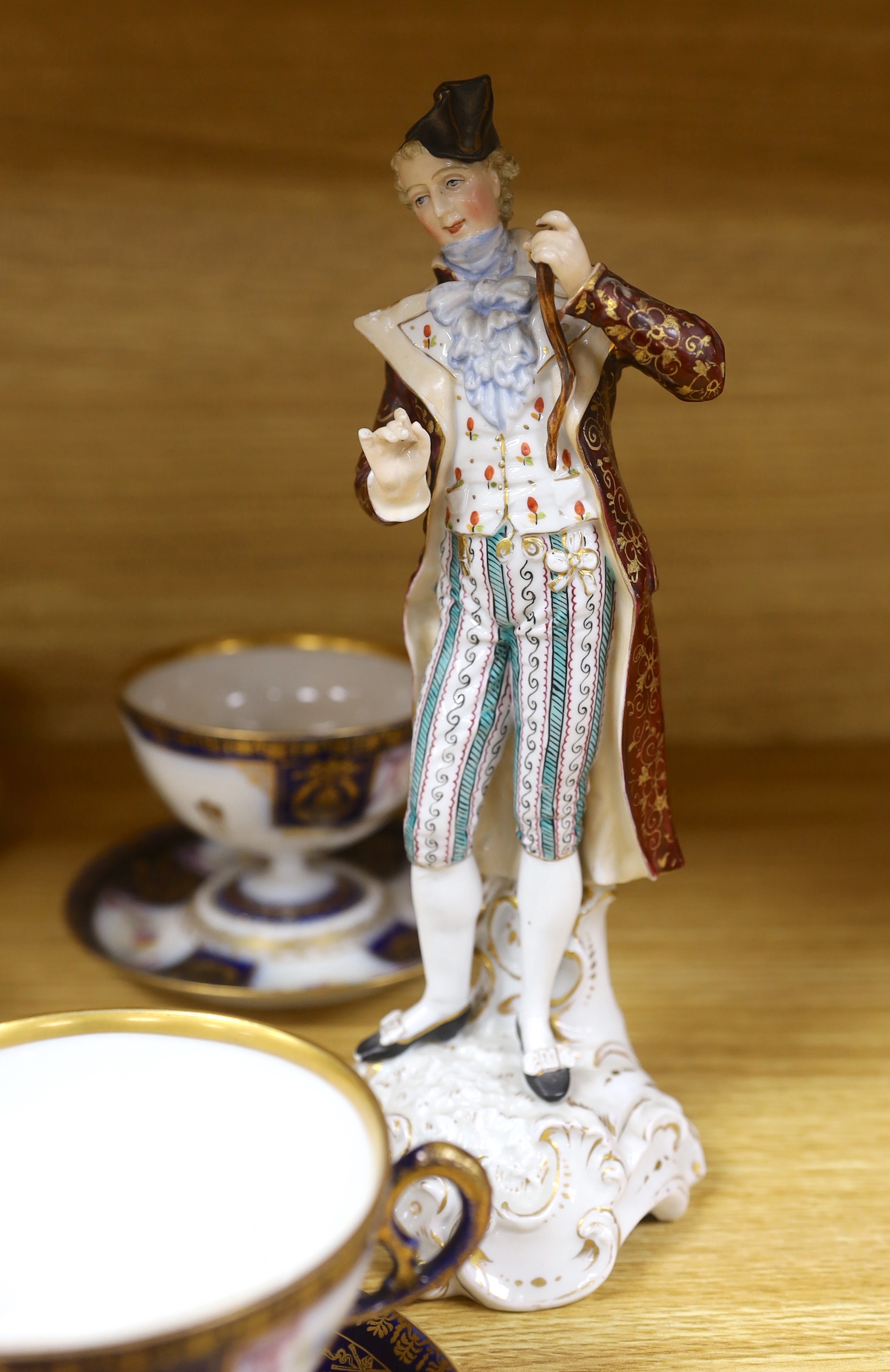A group of European porcelain tableware to include a pair of figures, Lowestoft jug, Dresden cups etc.